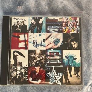 U2 Achtung Baby Album CD with Colorful Collage Cover